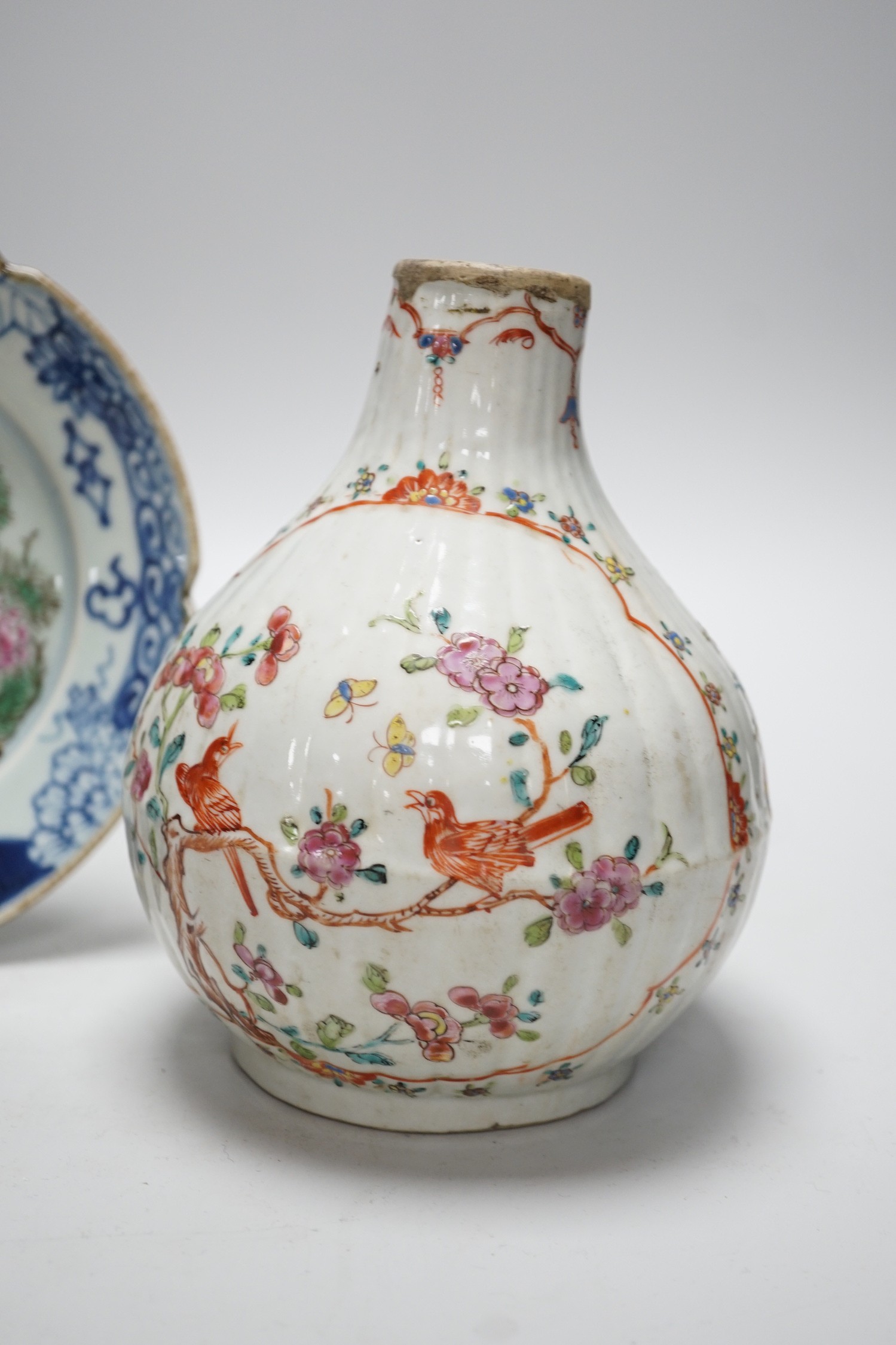 A Chinese Kangxi period clobbered bottle vase, reduced, height 29.5cm, and a Chinese plate, vase 18cms high